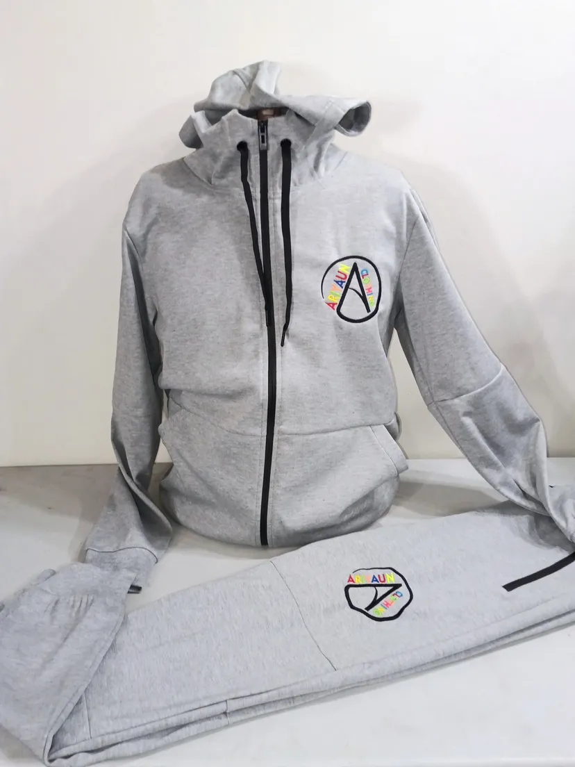 Heather gray full-zip tracksuit set with the multicolor Ariyaun circle logo embroidered on the chest and thigh